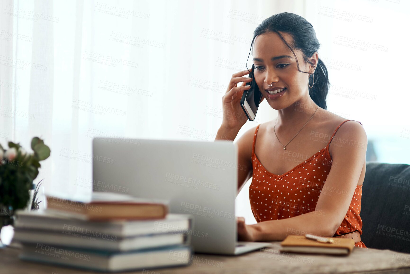 Buy stock photo Happy woman, laptop and and typing with phone call for discussion, conversation or writing at home. Young, female person or author talking on mobile smartphone for remote work, ebook or online novel