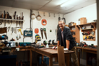 Buy stock photo Happy man, portrait or carpenter with workbench or tools for project or woodwork at manufacture. Young, male person or designer with smile, material or equipment for DIY, artisan or craft at workshop