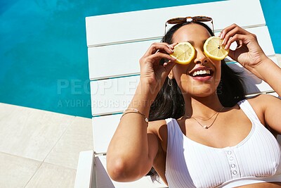 Buy stock photo Orange, swimming pool and tanning with woman outdoor on lounger for holiday, travel or vacation. Bikini, relax and wellness with smile of happy tourist person at hotel, lodge or resort for weekend