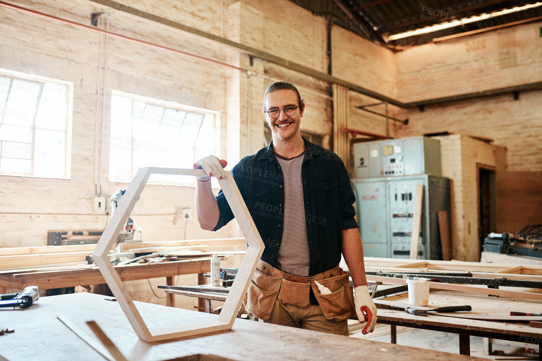 Buy stock photo Workshop, man and happy for carpentry with furniture or woodwork with pride in England. Male person, portrait and smile as employee with small business at warehouse for manufacturing and supply chain