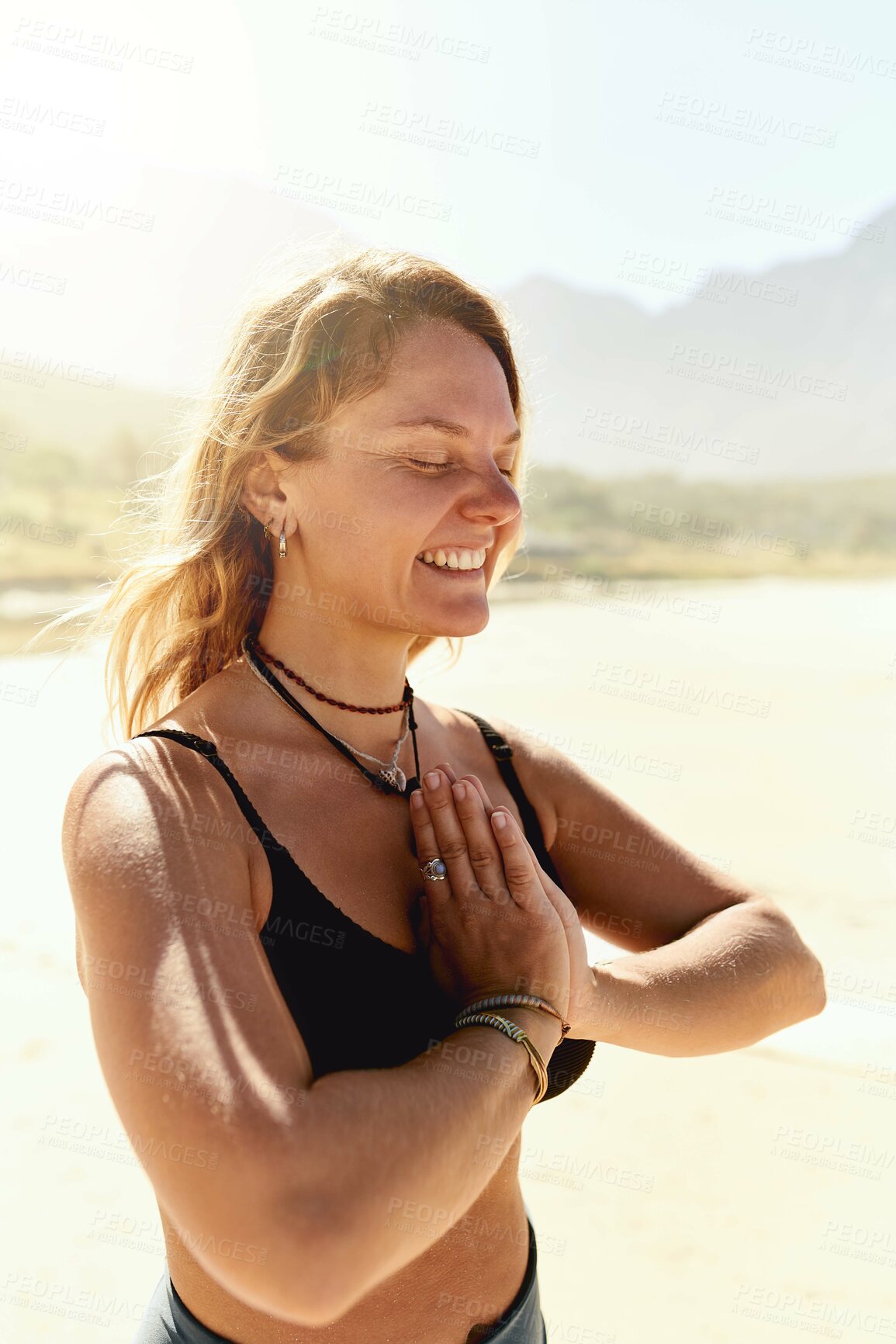 Buy stock photo Namaste, meditation and happy woman on beach with peace, health or wellness for holistic outdoor care. Zen, relax and girl at ocean for mindfulness, calm smile or yoga in nature for spiritual balance