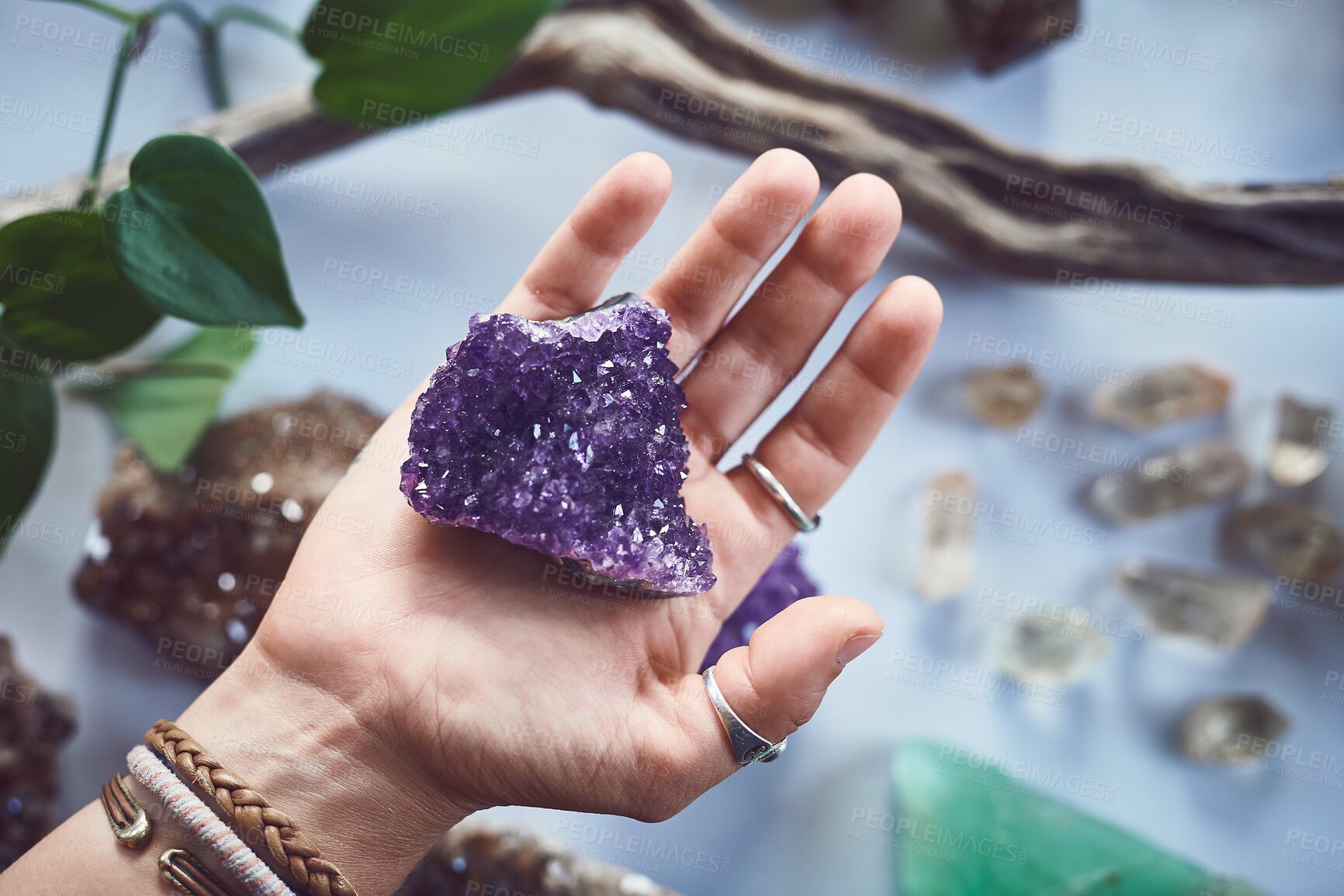 Buy stock photo Hands, above and person with crystals, quartz and healing with belief, relax and spirit rock. Closeup, yogi and artist with tattoo, zen and mindfulness with energy stone, natural minerals and peace