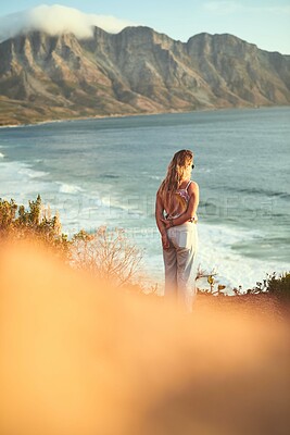 Buy stock photo Woman, mountain and ocean for view, travel and tropical holiday outdoor with peace on weekend break. Female person, nature and back for relax, trip and vacation with sunshine, calm and mindfulness