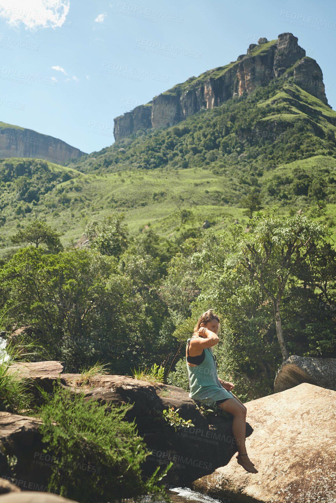 Buy stock photo Woman, mountain and rock for hiking, travel and tropical holiday outdoor with peace on weekend break. Female person, nature and explore for relax, trip and vacation with sunshine, calm or mindfulness