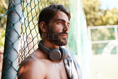 Buy stock photo Basketball, headphones and thinking with sports man on court of exercise, fitness or game in summer. Break, idea and idea with shirtless athlete outdoor for challenge, competition or performance