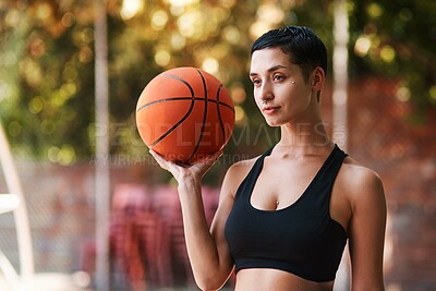 Buy stock photo Woman, sport and basketball player with ball for game, match or fitness at outdoor court. Young, female person or active athlete with recreation or skill for challlenge, competition or tournament