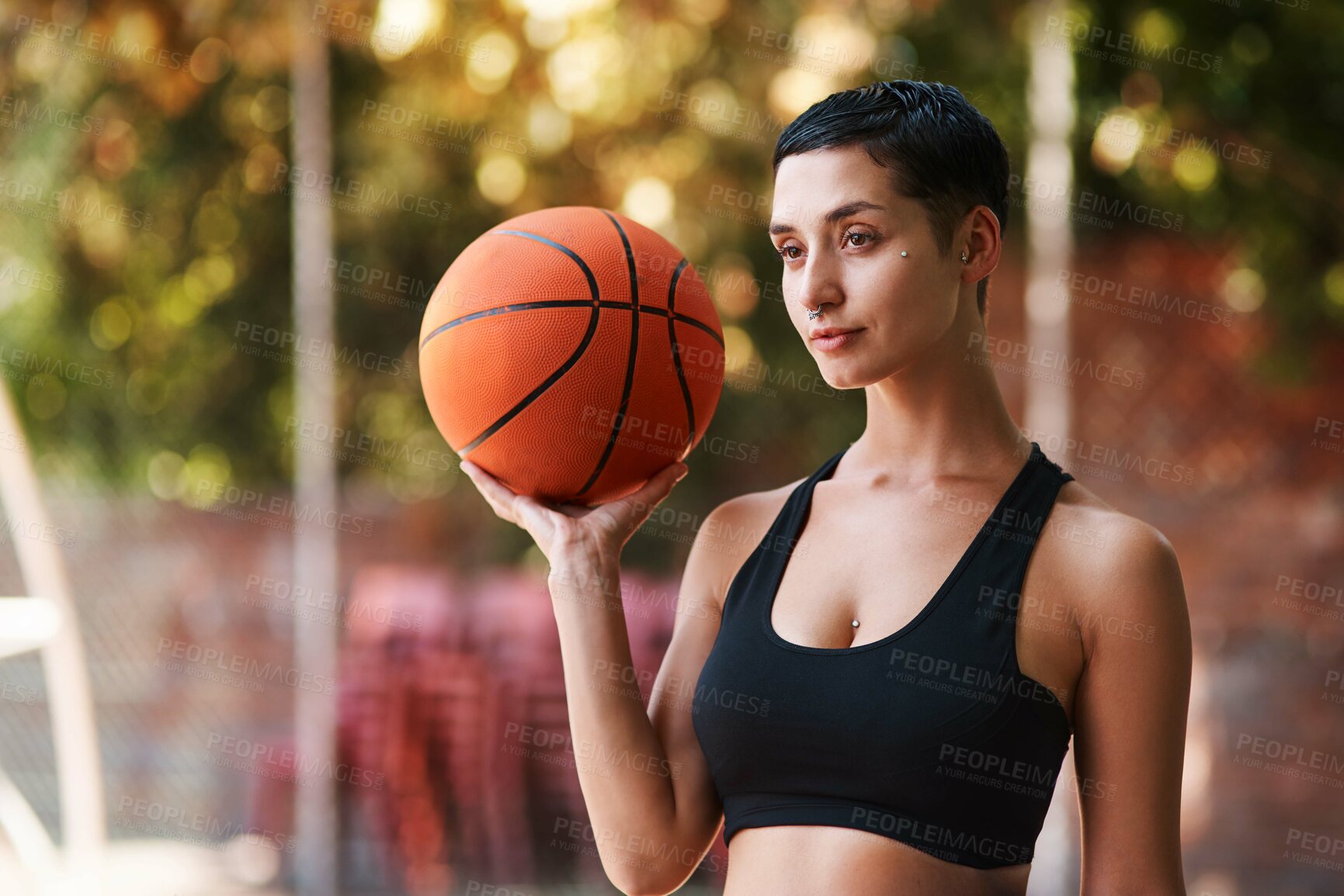 Buy stock photo Woman, sport and basketball player with ball for game, match or fitness at outdoor court. Young, female person or active athlete with recreation or skill for challlenge, competition or tournament