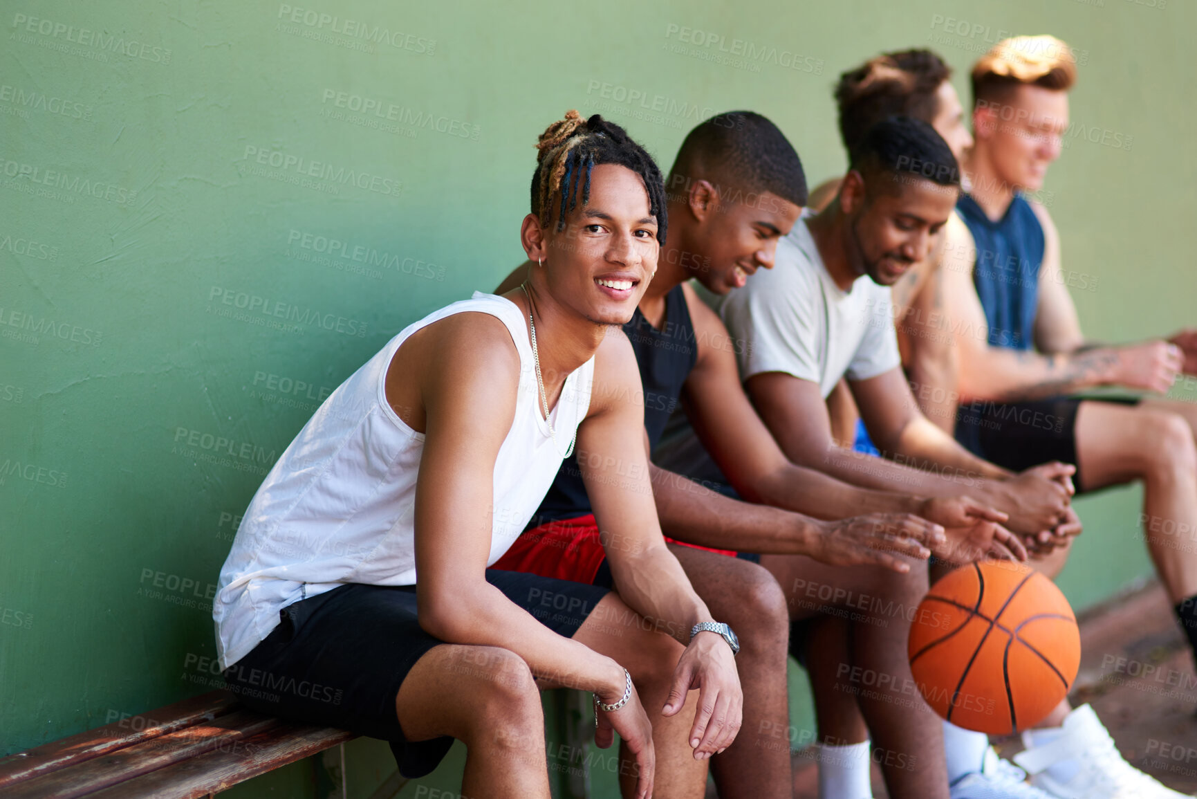 Buy stock photo Bench, basketball and happy man on court for break, fitness exercise and wellness in sports match. Relax, tired athlete or portrait of healthy player resting for performance, workout or outdoor game