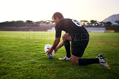 Buy stock photo Rugby, man and player with ball, outdoor and performance for practice, game and fitness for athlete. Playground, grass and professional with strength, match and training for football and person