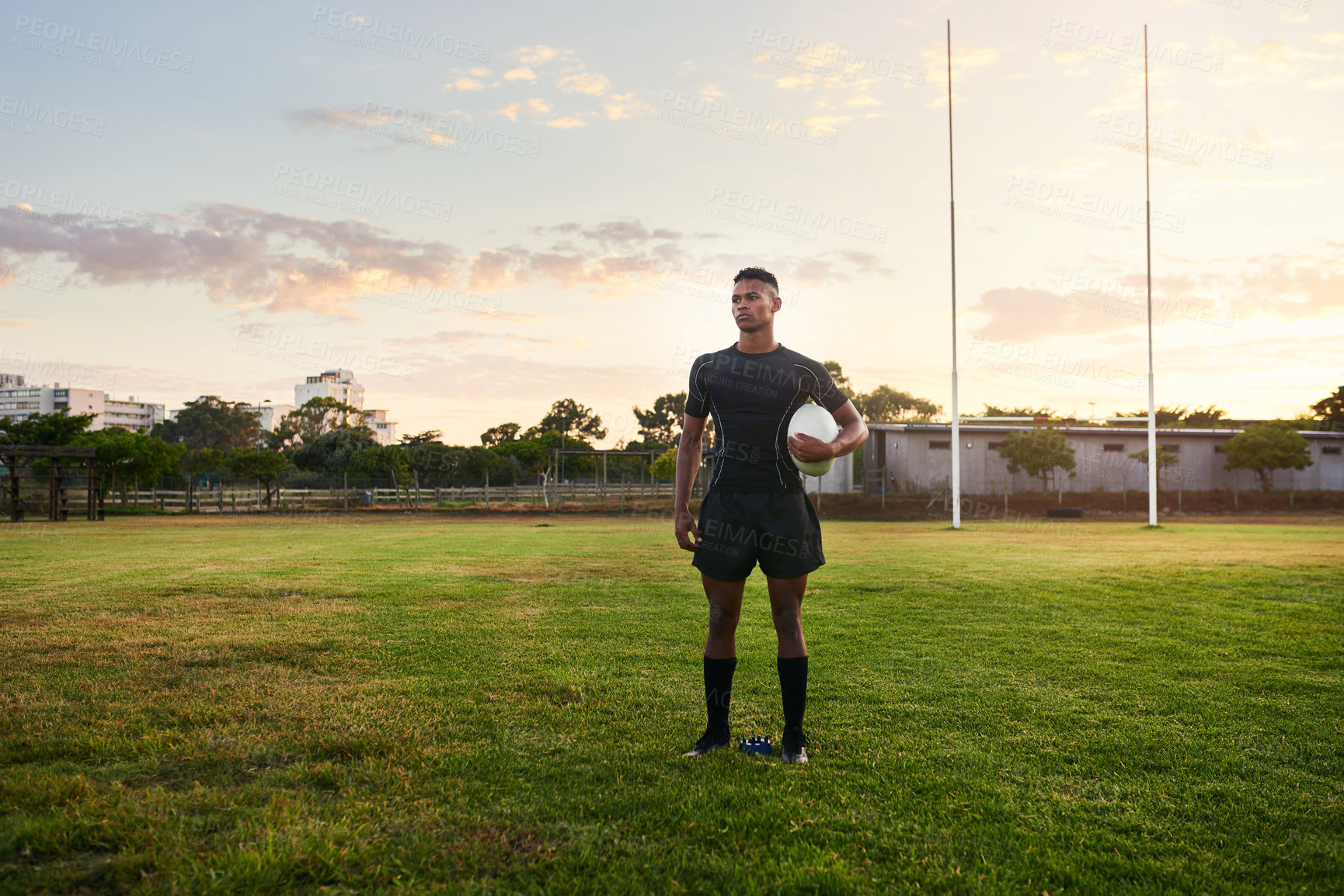 Buy stock photo Rugby, man and thinking on field with ball, training ambition and mindset for tournament with space. Sport, athlete and determination on stadium grounds for fitness, game plan and idea in New Zealand