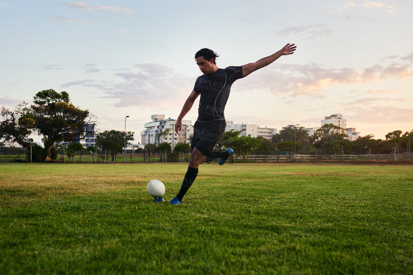 Buy stock photo Rugby, man and kick for performance, outdoor and game in stadium, match and player for competition. Professional, field and person with goals, campion and fitness of athlete, mockup and football