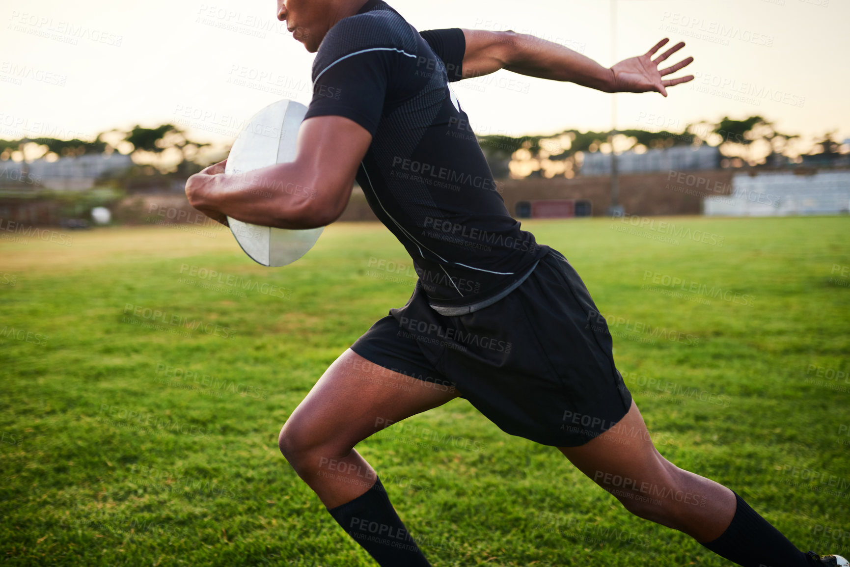 Buy stock photo Hands, energy and player with ball, rugby and training for match, performance and athlete with fitness. Outdoor, action and person in stadium, professional and preparing for competition and field