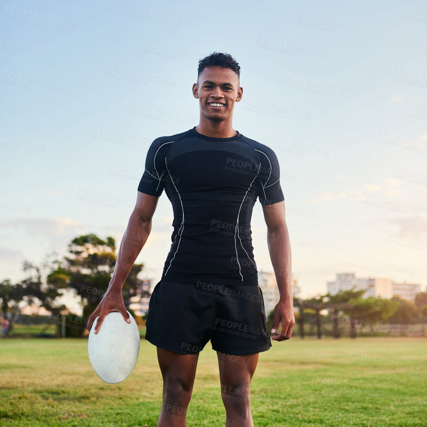 Buy stock photo Outdoor, portrait and man with ball, rugby and confident for match, stadium and fitness of player with smile. Playground, proud and training for competition, field and skill for sport and person