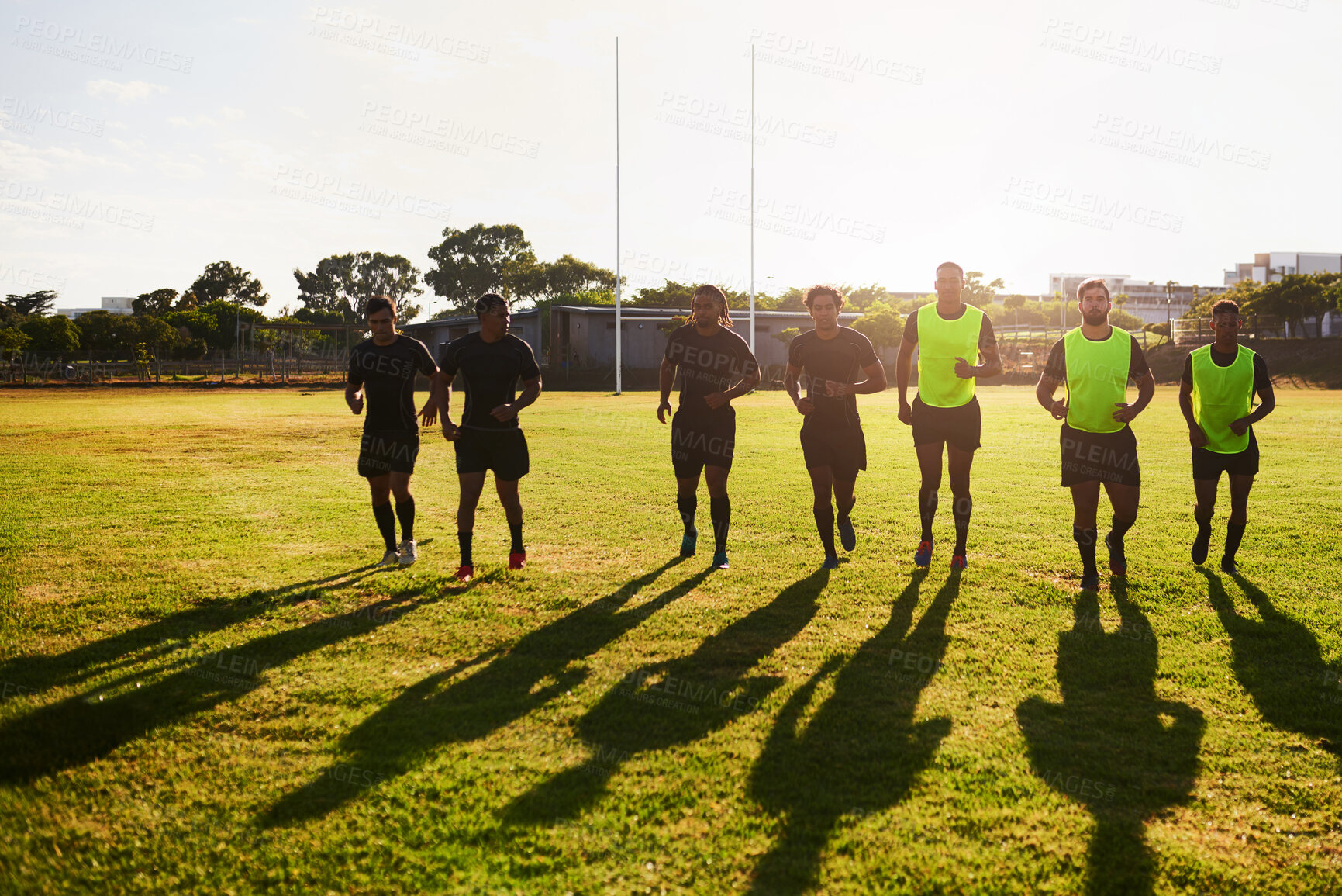 Buy stock photo Sports, team and men with warm up for rugby, competition game and practice with training for tournament. Stadium, people and players with running for fitness, endurance and group for match in France