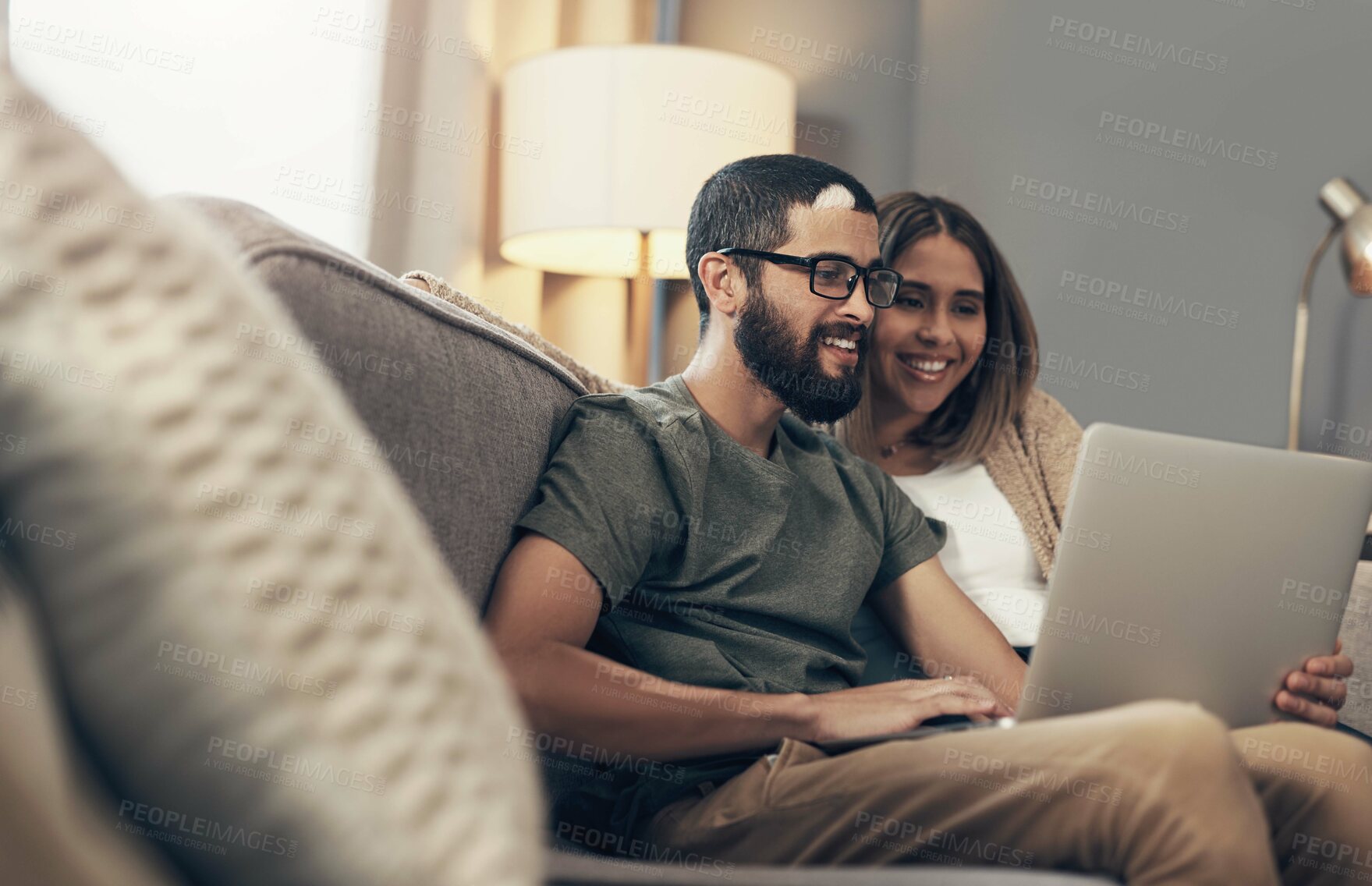 Buy stock photo Sofa, couple and smile with laptop for online, streaming movie and choice for entertainment at home. Happy people, woman and man with digital for connection, scroll film or bonding with love in house