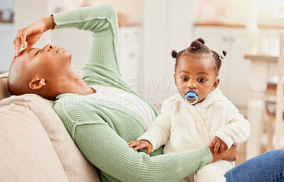 Buy stock photo Headache, stress and mother with baby in home with postpartum depression, fatigue or exhaustion. Burnout, migraine and tired African mom relax on sofa with infant kid in living room at family house.