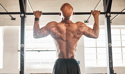 Buy stock photo Man, back or fitness with pull ups at gym for strength, muscle gain or workout on equipment. Active, muscular or strong male person hanging or lifting body weight for training exercise at health club