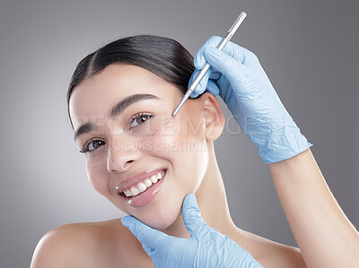 Buy stock photo Woman, portrait and filler consultation in studio, skincare and cosmetic service on gray background. Female person, procedure and plastic surgery or treatment, writing and implant or beauty