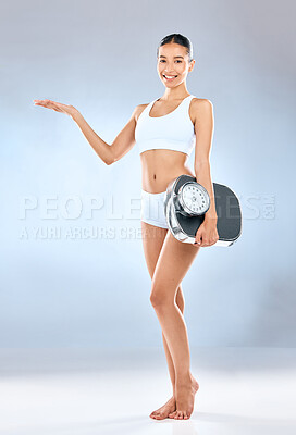 Buy stock photo Happy woman, portrait and palm with scale for choice, presentation or pick on a blue studio background. Female person or model with underwear and open hand for showcase, list or steps to wellness