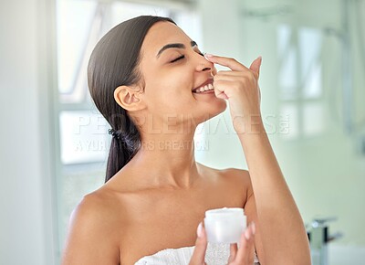 Buy stock photo Beauty, lotion and nose with woman in bathroom of home for morning skincare routine or wellness. Cream, eye closed and smile of happy person in towel at apartment for facial dermatology treatment