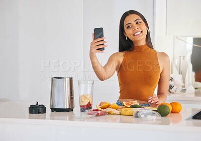 Buy stock photo Woman, selfie and morning smoothie in home, cooking and fruit for mineral liquid in kitchen. Female person, photography and online for social media update on diet, breakfast post and blender detox