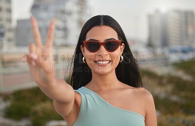 Buy stock photo Portrait, peace sign and woman with sunglasses, outdoor and travel with review for Bali, smile and adventure. Face, person or girl with shades, hand gesture and v sign with symbol, holiday or support