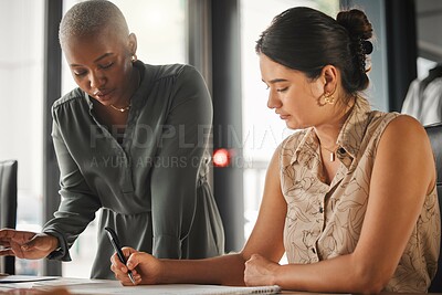 Buy stock photo Business women, designers or writing with planning for project, agenda or meeting at office. Young, female people or colleagues working, drawing or sketching with paper for creative design or ideas