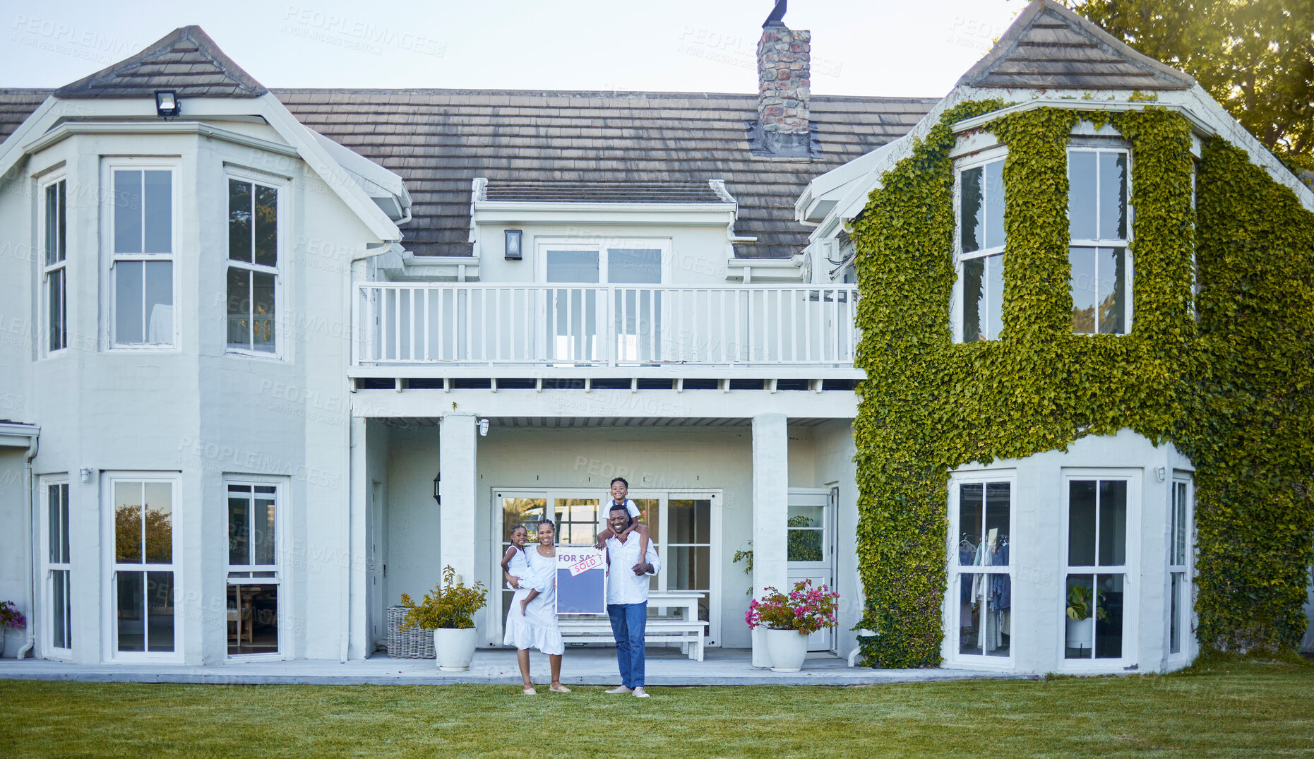 Buy stock photo Woman, man and kids at new home with sold sign, real estate or property as African family for mortgage. Happy people, house and children with bonding, sale and loan as owner, buyer or investment