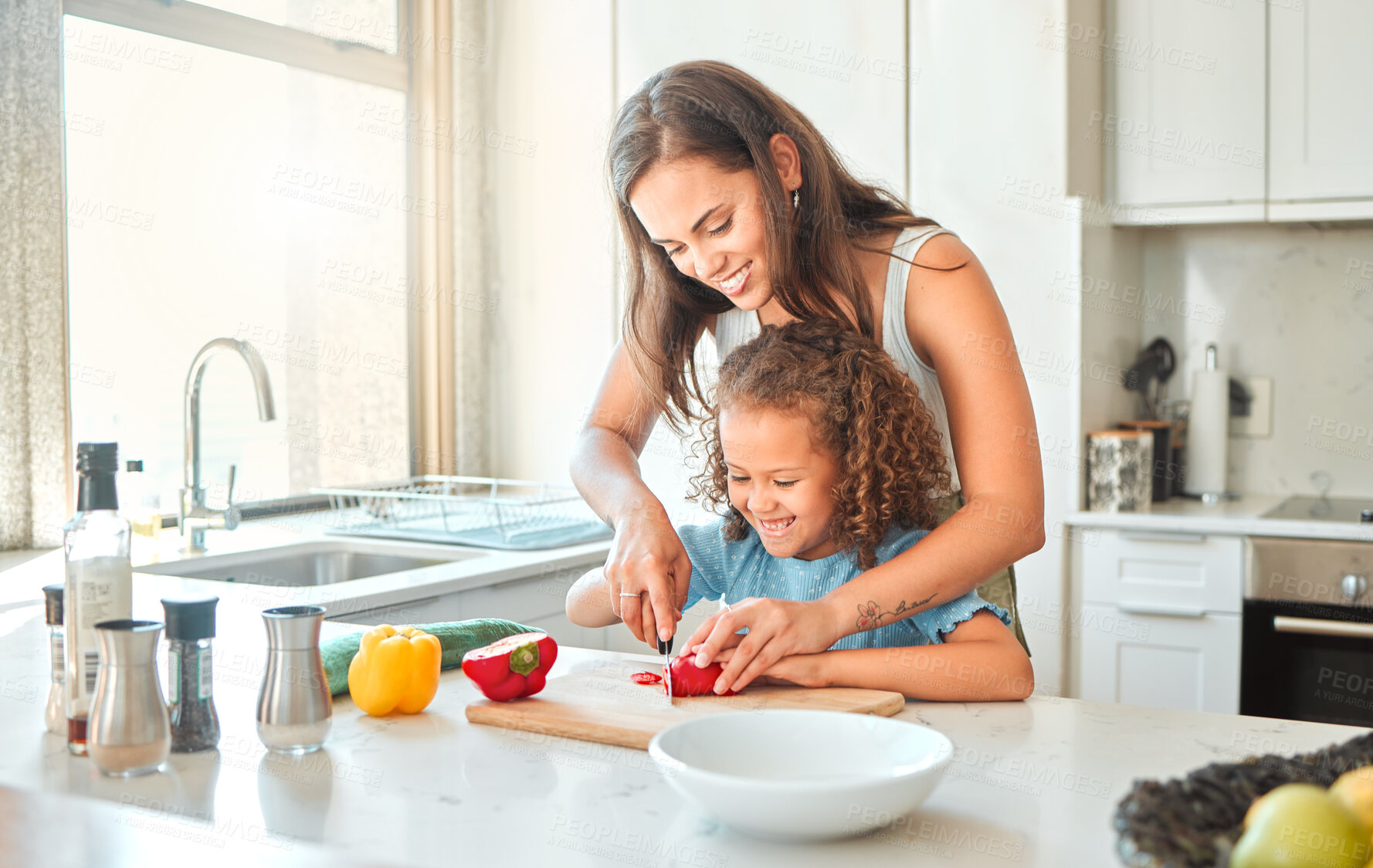 Buy stock photo Woman, girl and learning to cook with smile, help and guidance for support in kitchen. Mother, child and vegetables cut teaching for dinner, meal and healthy salad diet with fun bonding at home