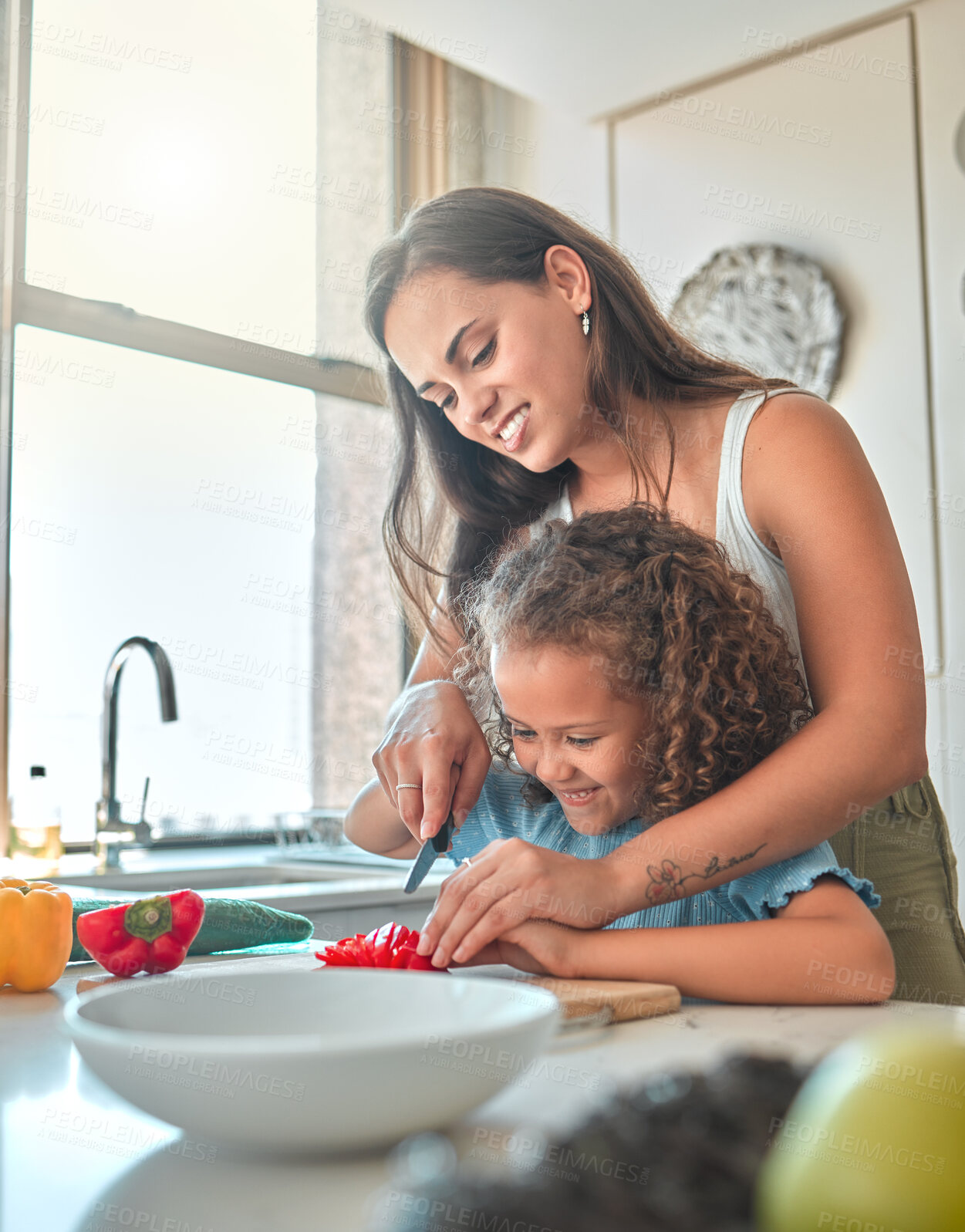 Buy stock photo Mother, child and teaching to cook with smile, help and guidance for support in kitchen. Woman, girl and learning to cut vegetables for dinner, meal and healthy salad diet with fun bonding at home