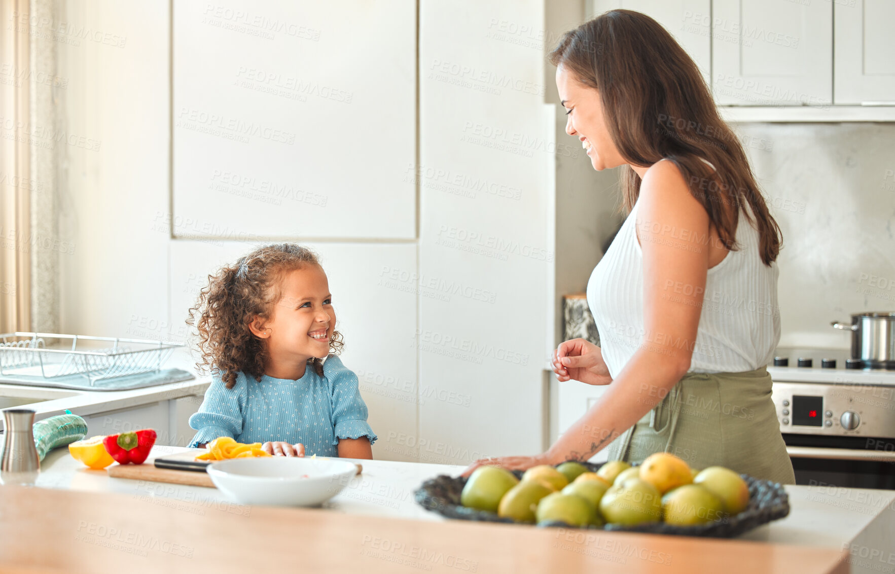 Buy stock photo Mother, child and happy with smile, help and guidance for cooking and support in kitchen. Woman, girl and learning to cut vegetables for dinner, meal and healthy salad diet with fun bonding at home