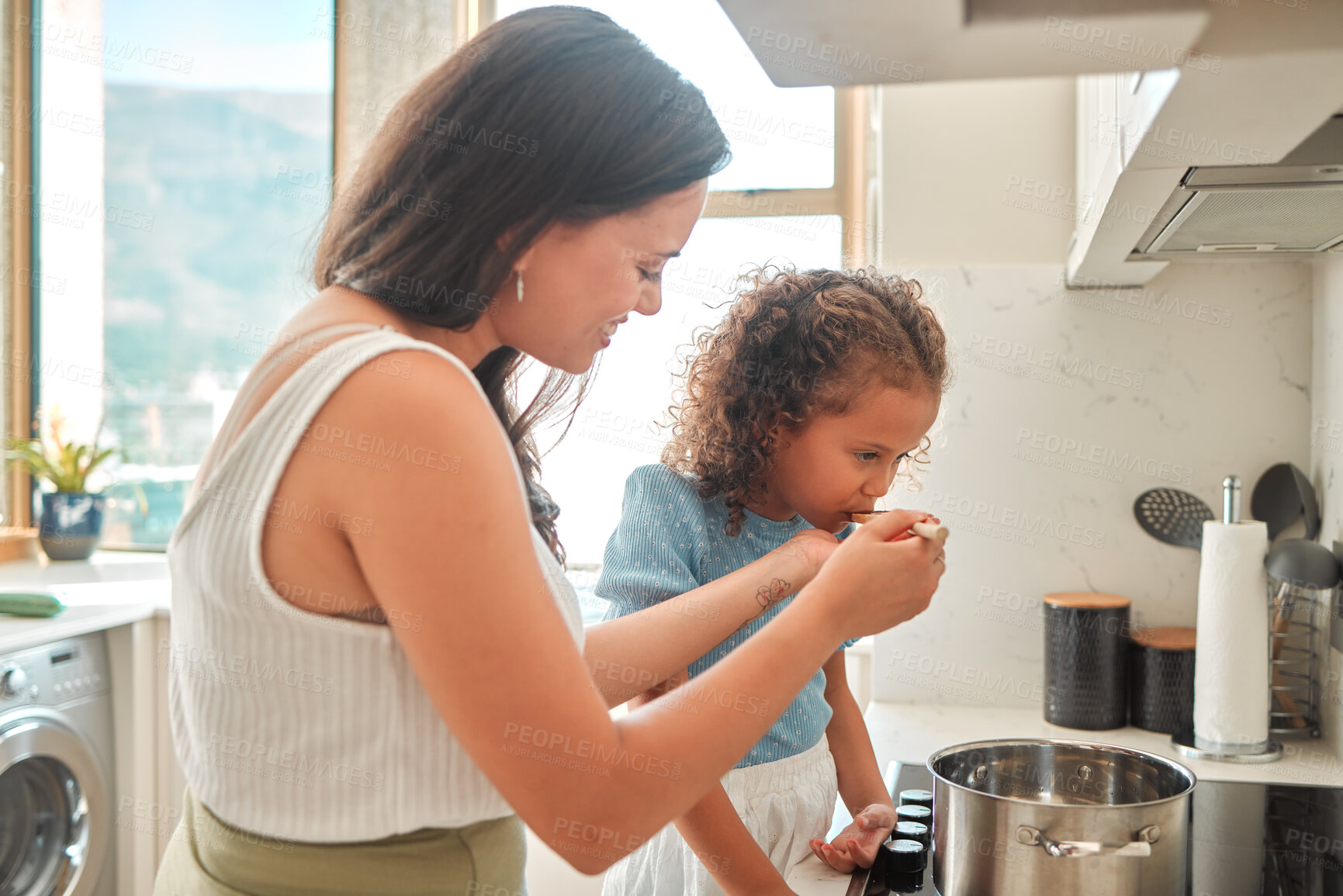 Buy stock photo Woman, child and learning cooking with taste, smile and guidance for support in kitchen. Mother, girl and teaching stove safety for dinner, meal and healthy diet preparation with fun bonding at home