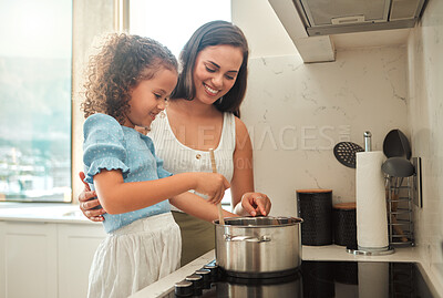 Buy stock photo Woman, girl and learning cooking with pot, smile and guidance for support in kitchen. Mother, child and teaching stove safety for dinner, meal and healthy diet preparation with fun bonding at home