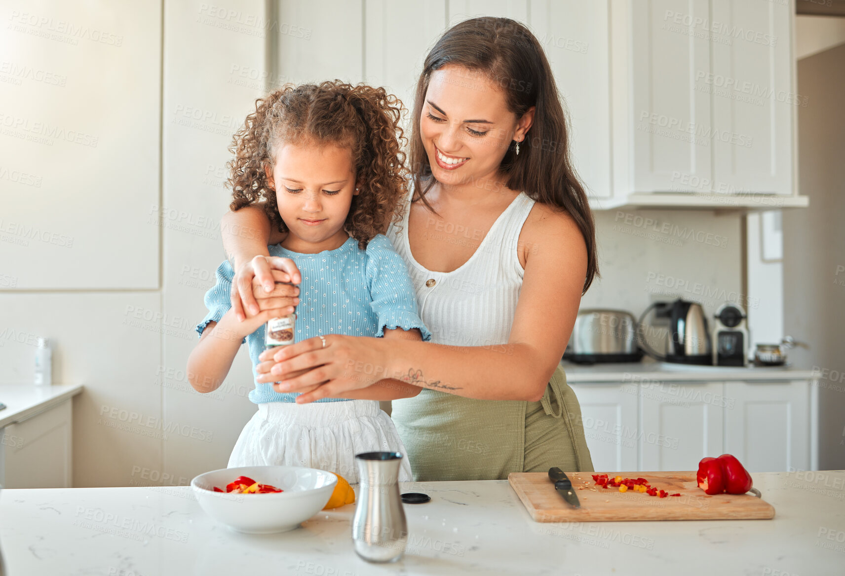 Buy stock photo Woman, girl and teaching with smile, pepper grinder and guidance for cooking and seasoning in kitchen. Mother, child and learning with vegetables for dinner, meal and healthy diet with fun at home