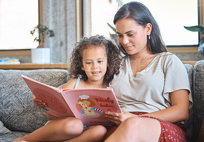 Buy stock photo Mother, girl and reading story in home, learning language and support education in living room. Mama, daughter and helping kid with fantasy book on couch, magical literature and bonding together