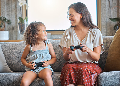 Buy stock photo Mother, girl and joystick for games in home, family and online competition or match in living room. Mama, daughter and streaming challenge for entertainment, bonding and playing together in apartment