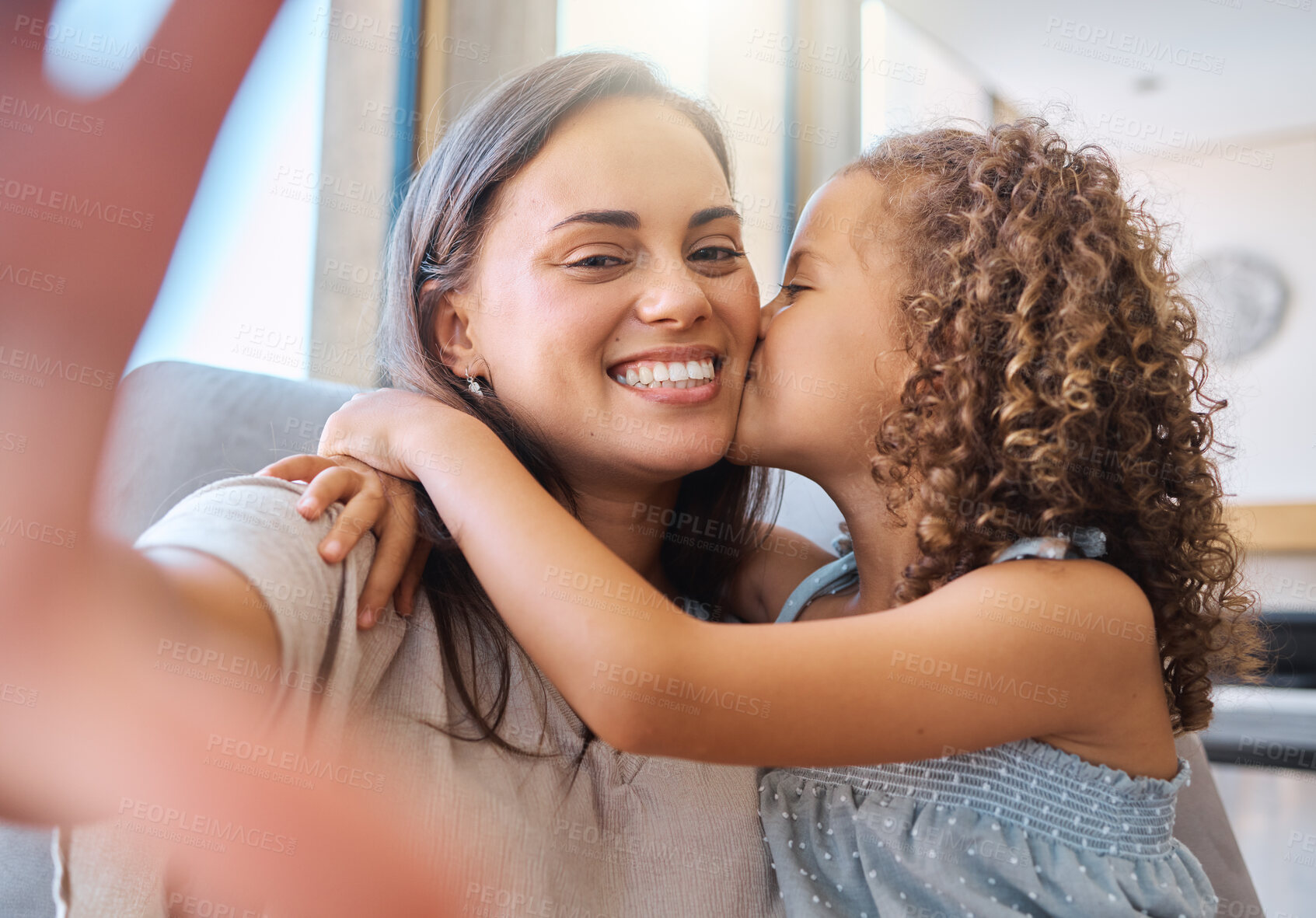 Buy stock photo Kiss, selfie and mom on sofa with child for morning bonding, memory and relax in family home. Love, mother and daughter on couch with digital photography, care and happy hug in living room together