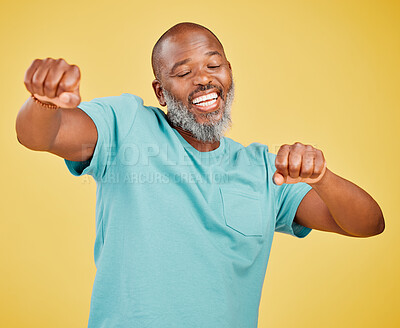 Buy stock photo Black man, studio and dancing with fist pump for music, fun and smile or enjoy on yellow background. Mature person, isolated and happiness with eyes closed for victory, winning and achievement