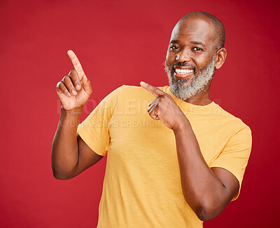 Buy stock photo Black man, studio background and happy with pointing on portrait for fashion announcement and promotion. Mature man, smile and confident with news for discount, deal and offer with advertising