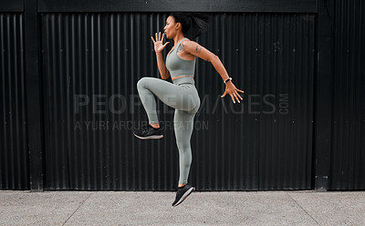 Buy stock photo Fitness, woman and jumping workout outdoor for warm up, cardio exercise and wellness challenge. Runner, athlete and energy in city for training, performance and endurance for healthy body and balance