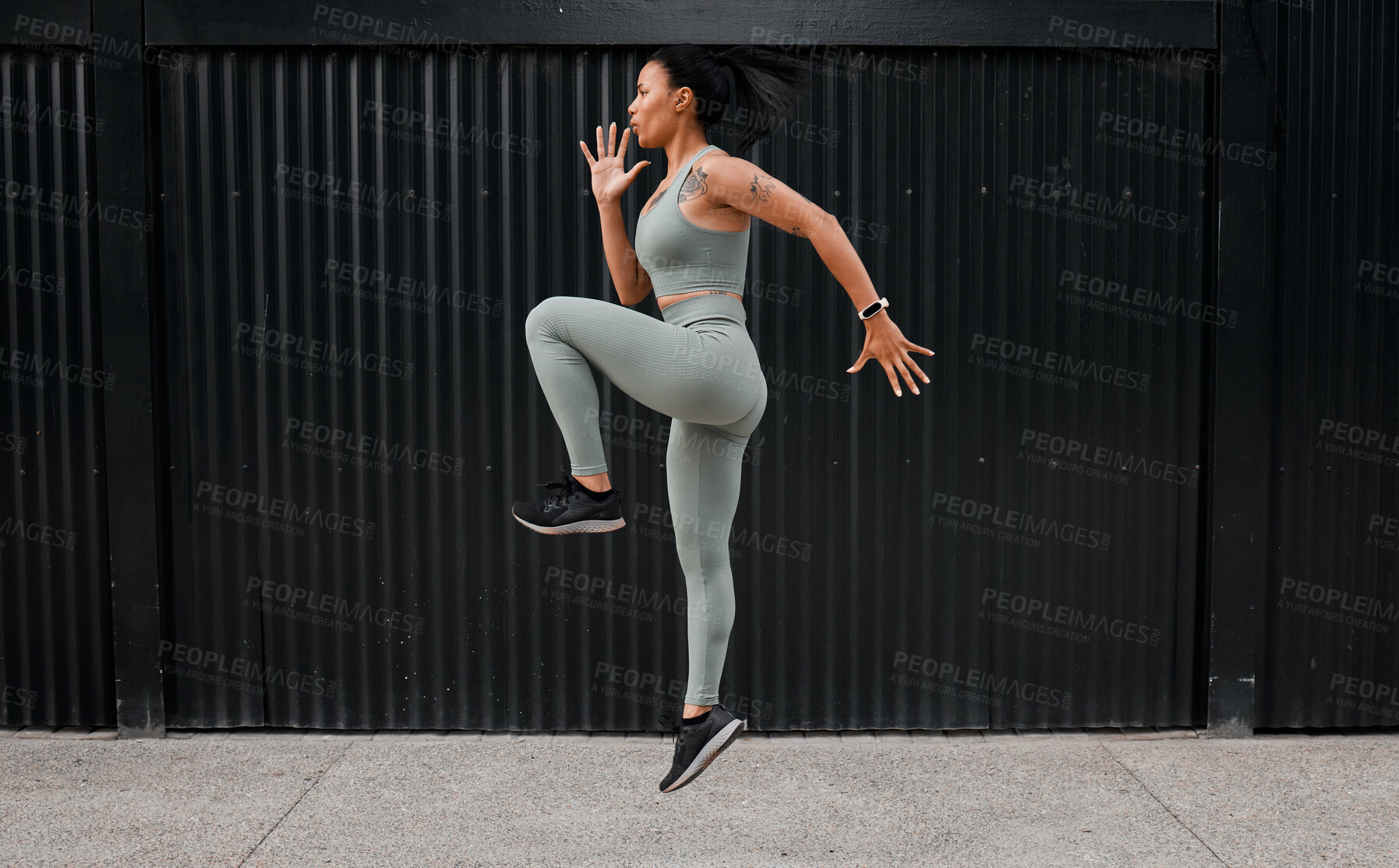 Buy stock photo Fitness, woman and jumping workout outdoor for warm up, cardio exercise and wellness challenge. Runner, athlete and energy in city for training, performance and endurance for healthy body and balance