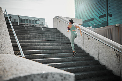 Buy stock photo Back, woman and running with headphones on steps for cardio training, listen to music and marathon practice. Athlete, girl and fitness exercise with endurance, sports workout and race performance