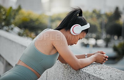 Buy stock photo Fitness, girl or headphones with break in city for exercise, listening to music or relax from workout. Athlete, runner or woman in urban town with resting for morning jog, cardio training or wellness