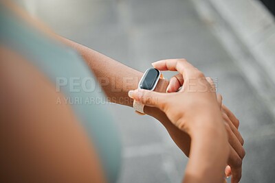 Buy stock photo Fitness, tracking and watch with woman runner outdoor in city for cardio, training or workout. App, checking time and exercise with sports person in urban town from above for improvement or progress