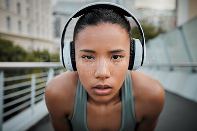 Buy stock photo Woman, portrait and headphones outdoor for fitness, exercise and music with determination and workout. Athlete, face and challenge in city for training, sports and resilience with healthy cardio run