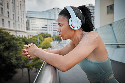 Buy stock photo Fitness, woman or headphones with break in city for exercise, listening to music or relax with thinking of progress. Athlete, runner or girl in urban town for morning jog, cardio training or wellness