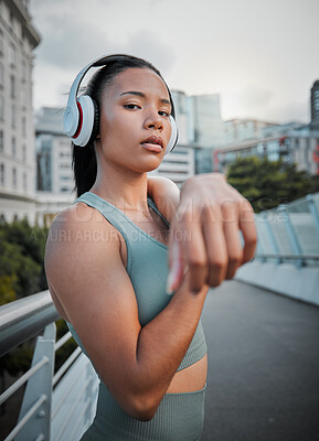 Buy stock photo Portrait, woman or runner stretching on bridge in city for fitness, training or exercise health. Music, headphones or girl athlete in warm up for workout performance, outdoor jog or running sports