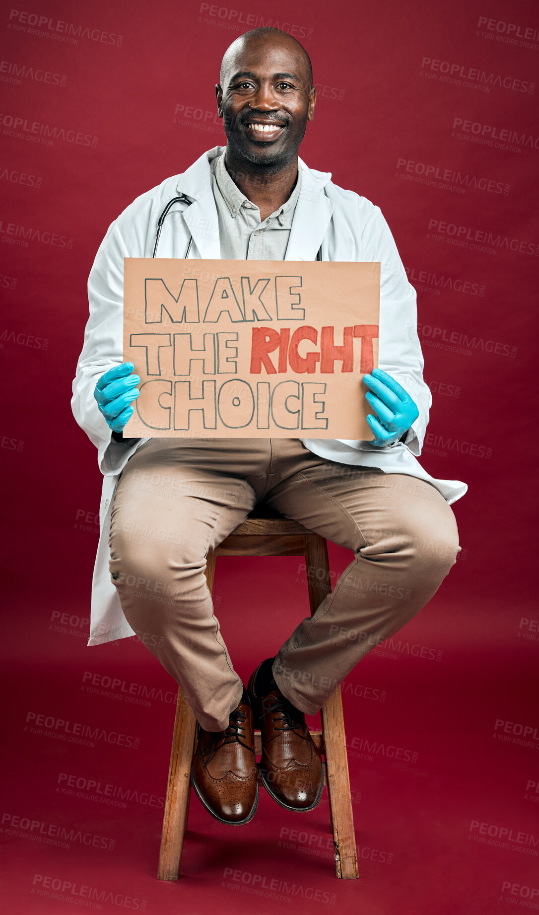 Buy stock photo Doctor, portrait and vaccine poster in studio for covid attention, healthcare choice and medical cure. Smile, black man and billboard information for treatment advice, virus safety and red background