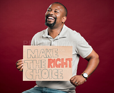 Buy stock photo Man, poster and choice in studio with smile, vaccine and protest sign for healthcare by red background. African person, placard or cardboard for medicine, drugs or thinking with activism for wellness