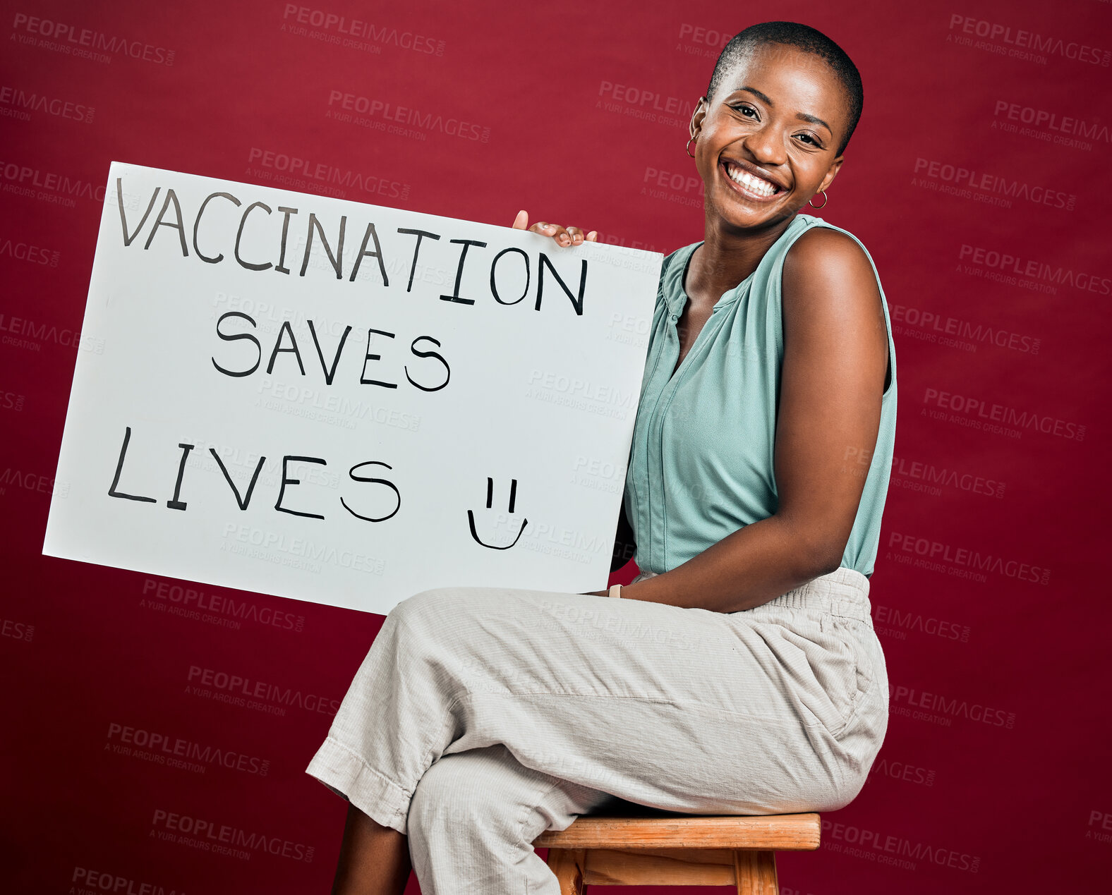 Buy stock photo Poster, smile and vaccine with portrait of black woman in studio on red background for healthcare or medical. Covid, pandemic and vaccination saves lives sign with patient for support or wellness